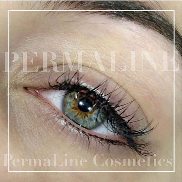 A close up of a woman's eye with the words'permaline cosmetics'.
